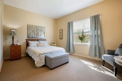 A well-furnished private bedroom in a nursing home
