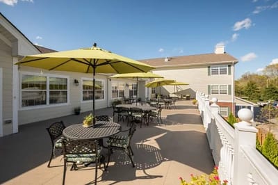 Patio area with tables and umbrellas outside