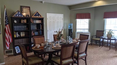 Dining area set up for a meal with table settings