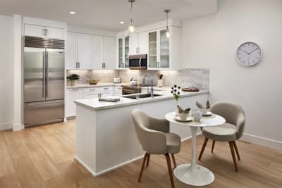 Modern kitchen with seating area and utensils