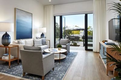 Bright common area with seating and outdoor view