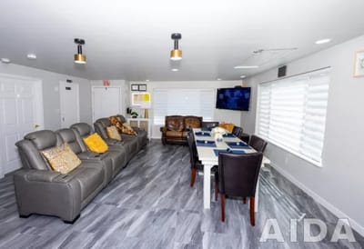 Bright common area with seating and dining table