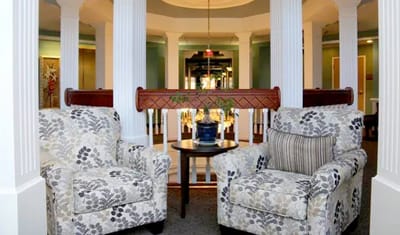 Cozy seating area with floral chairs in a common area