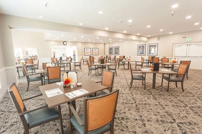 Dining area set up for residents with tables and chairs