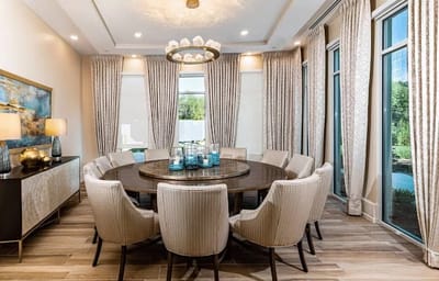 A modern dining area with elegant decor and large windows