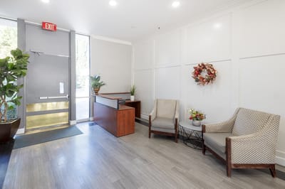 Bright lobby area with seating and plants