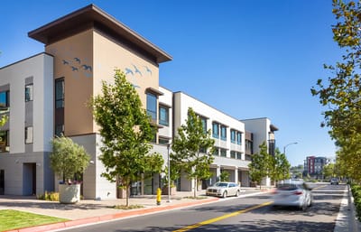Facade of Watermark Laguna Niguel with trees and clear sky