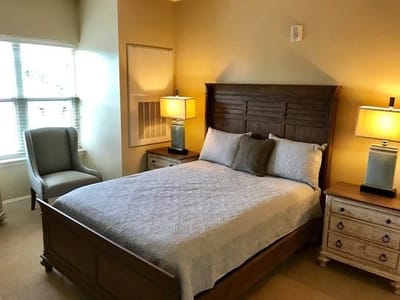 A cozy private bedroom with warm lighting