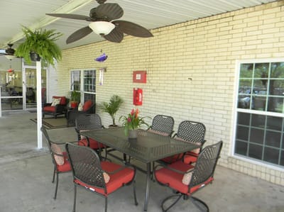 Outdoor dining area with tables and chairs