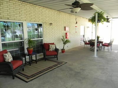 Outdoor seating area with plants and tables
