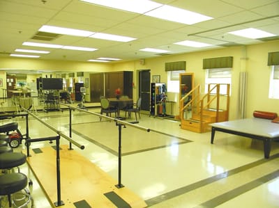Physical therapy room with rehabilitation equipment