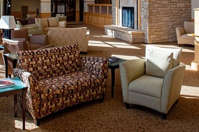 Interior seating area with couches and a fireplace