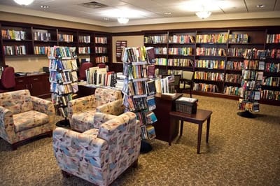 Cozy library area with bookshelves and seating
