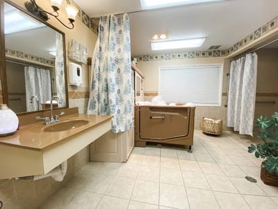 A well-lit bathroom in a senior care facility