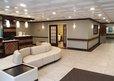 Bright lobby area with seating and reception desk