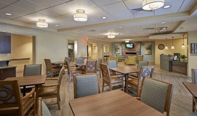 Interior view of a dining room with tables and chairs