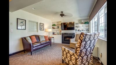 Cozy common area with seating and a fireplace