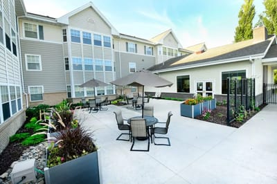 Outdoor patio area with seating and umbrellas