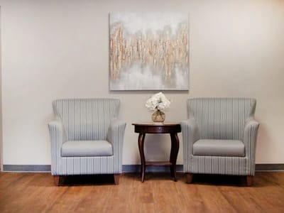 Cozy common area with two armchairs and a table