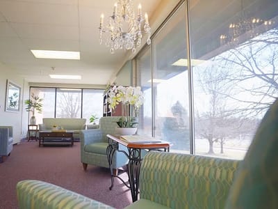 Bright common area with comfortable seating and large windows