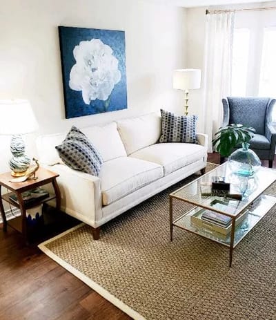 Bright, cozy interior living space with a sofa and artwork
