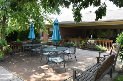 Outdoor patio area with seating and umbrellas