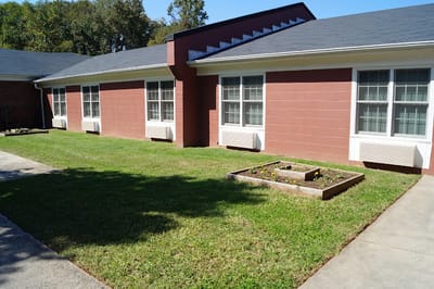 A well-maintained garden area outside the facility