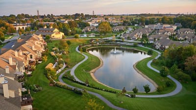 Aerial view of a serene community with water features