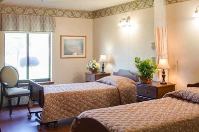 Cozy resident room with two beds and décor