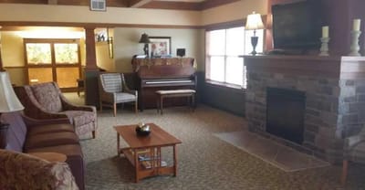 Cozy common area with seating and piano