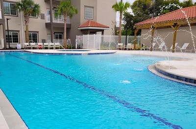 Outdoor swimming pool area with seating