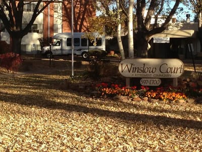 Exterior view of Winslow Court Retirement Community with fall foliage
