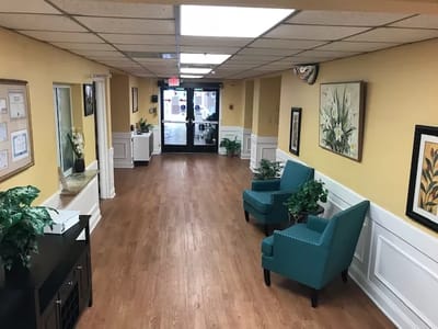 Brightly colored corridor with seating and decor