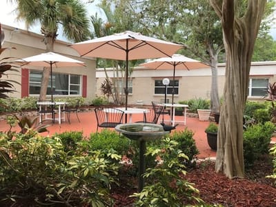 Outdoor patio with umbrellas and seating area