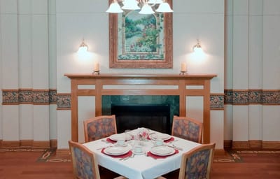 Dining table set with dishes in a cozy dining room
