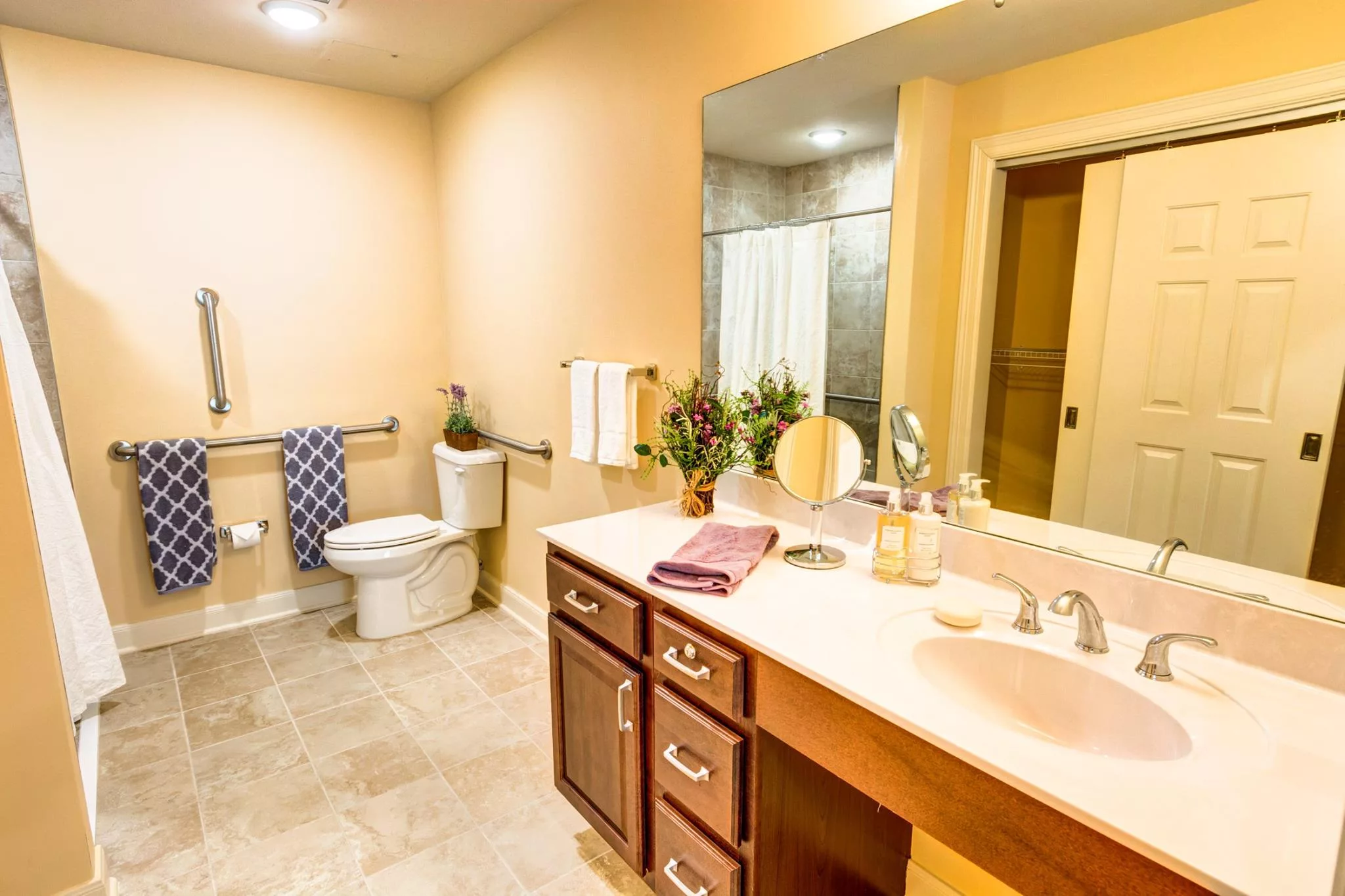 Well-lit bathroom with accessible features