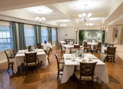 Bright and welcoming dining area with tables set up.