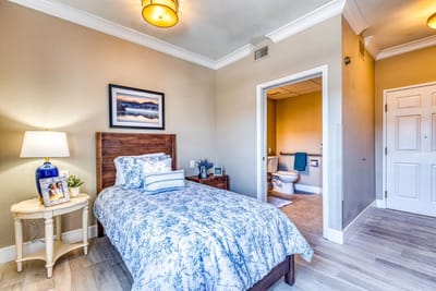 Cozy private resident room with a bed and decorative elements