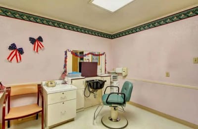 Barber station with patriotic decor in a facility room