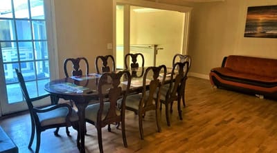 Dining area with wooden table and chairs