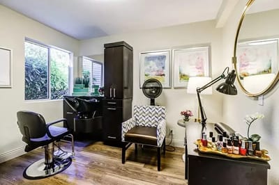 Interior view of a beauty salon space with styling chair