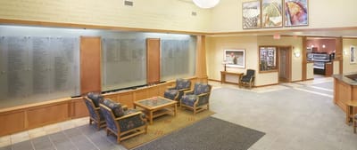 Interior common area with seating and decorative panels