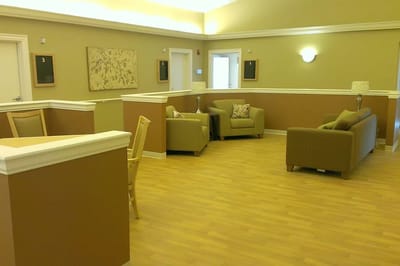 Common area seating with comfortable couches and lamps