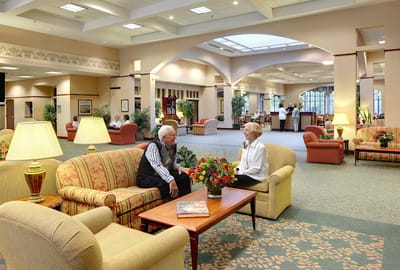 Residents conversing in a comfortable common area