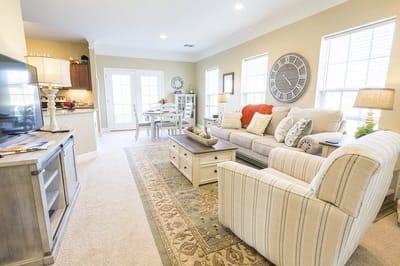Cozy common area with seating and a decorative clock