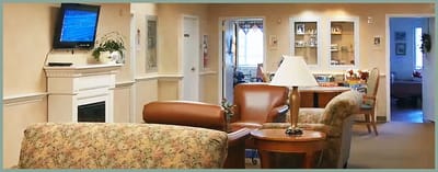 Interior view of a common area with seating and television