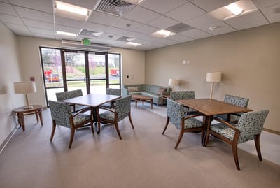 Bright interior common area with seating and tables
