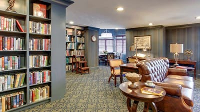 Cozy reading area with bookshelves and seating