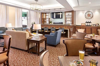 Bright common area with seating and bar