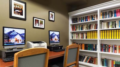 Interior common area with computers and bookshelves